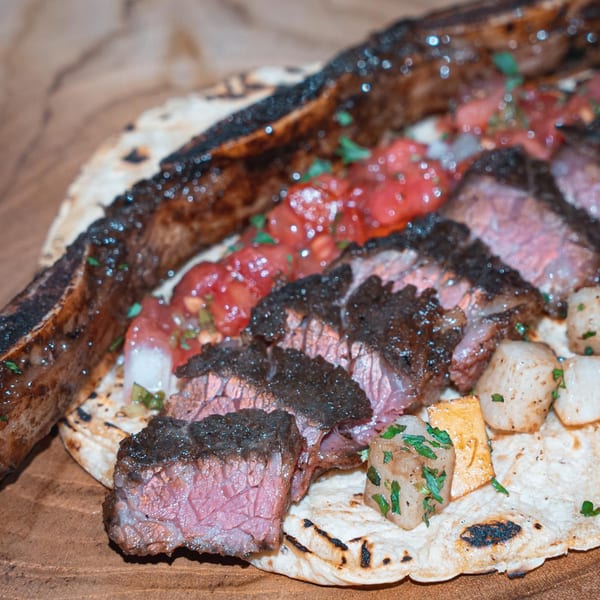 Grilled steak, sliced and served on a tortilla with salsa and diced potatoes at Rene's Mexican Kitchen.